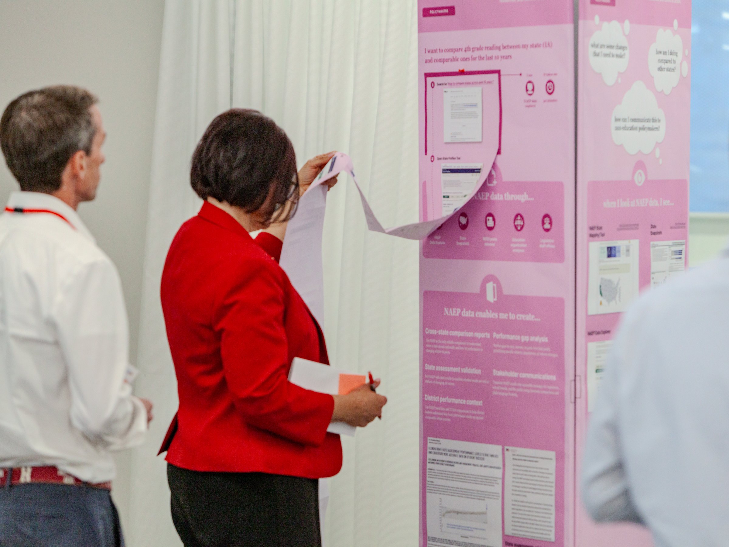 Stakeholder reviewing prioritization criteria posters during the second workshop